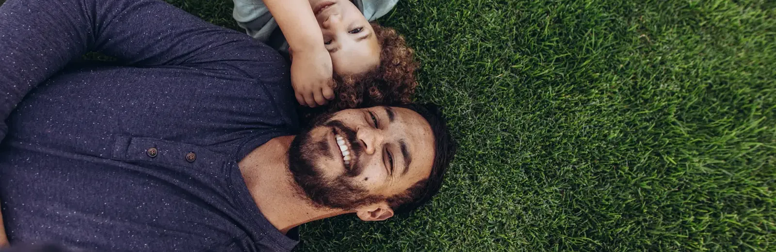 father son in grass